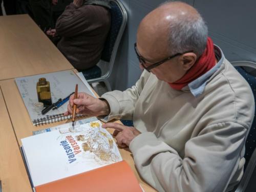 Expo BD- Dessinateur en pleine action